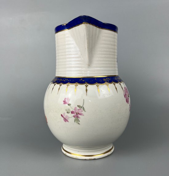 A late 18thc Derby jug hand painted in the manner of Edward Withers c.1775-80