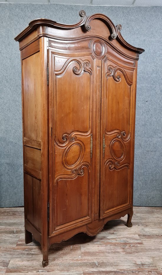 Louis XV period Cauchoise cabinet with gendarme hat in solid pine around 1750