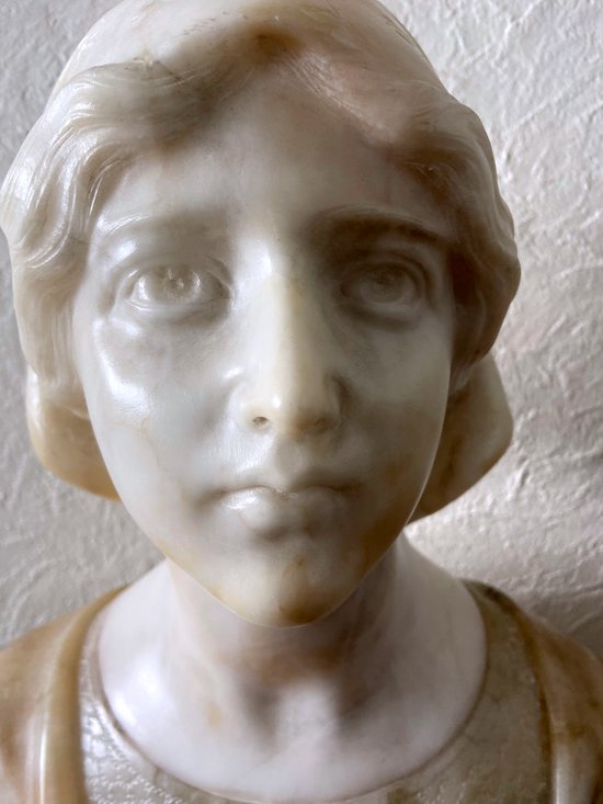 Bust of young woman