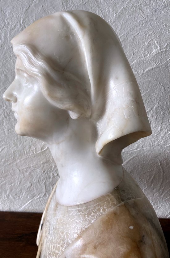 Bust of young woman