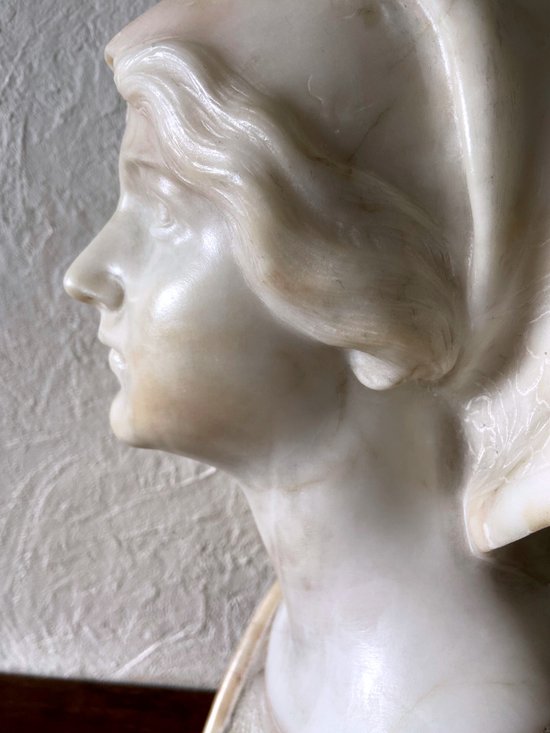 Bust of young woman