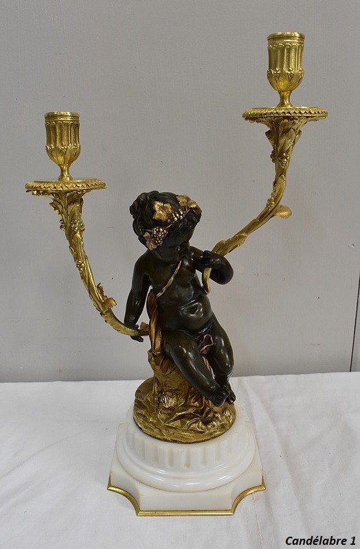 Pair of bronze candelabras "A Love and a Faun", after Clodion and Delarue - End of XIXth century