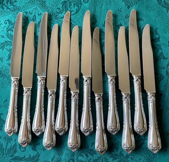 12 table knives.