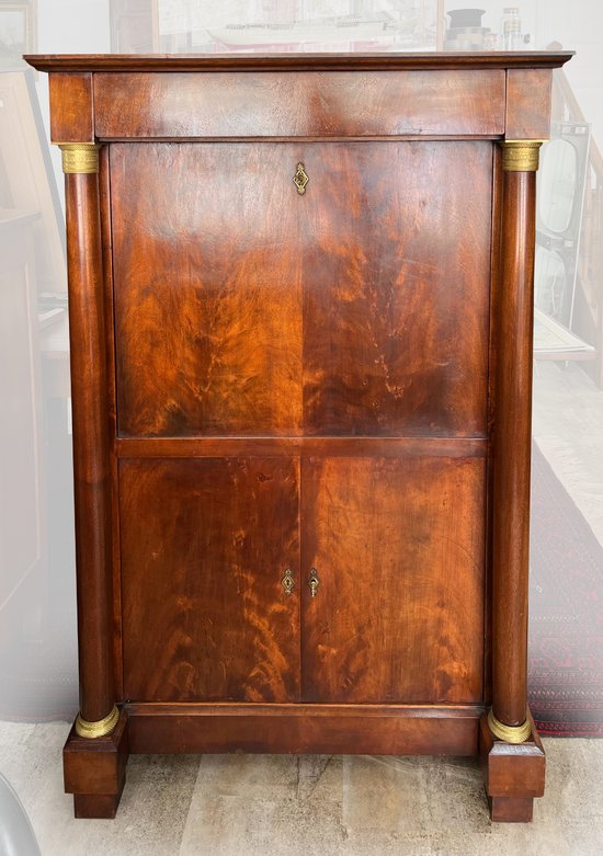 Mahogany secretary of style EMPIRE with detached columns