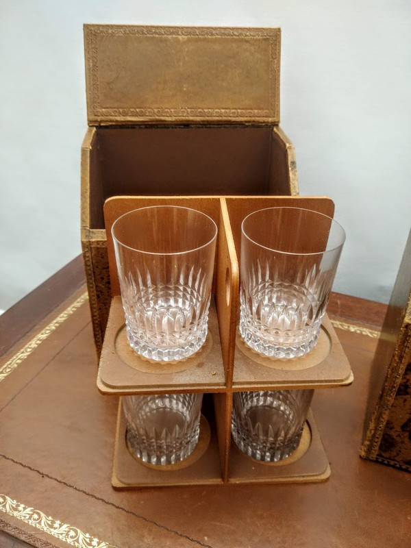 Pair of false book cases, with carafes and glasses.