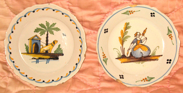 Pair of earthenware plates from Nevers, 18th century: the spinner - the dog