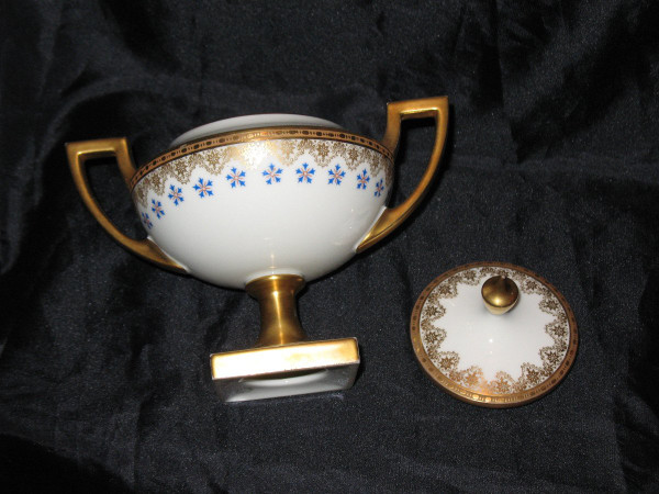 Cup and sugar bowl in Limoges porcelain by Jean Pouyat decorated with barbeaux, 19th century