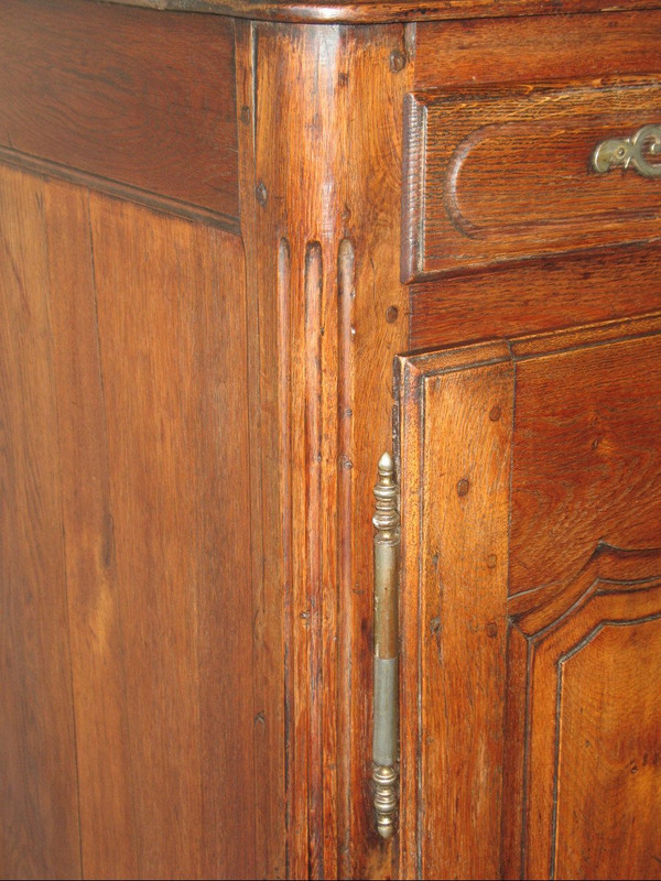 Low sideboard in molded and carved oak in the Louis XV style, 19th century