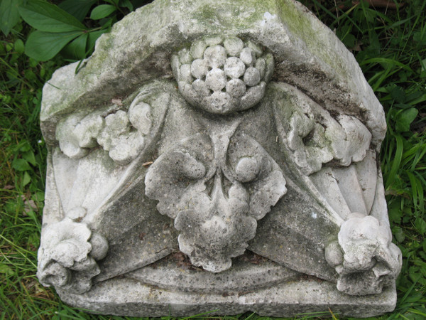 Pair of gothic style stone wall brackets decorated with plants