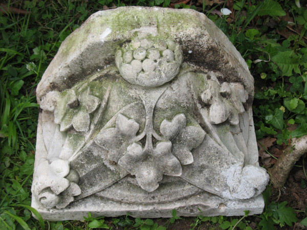 Pair of gothic style stone wall brackets decorated with plants