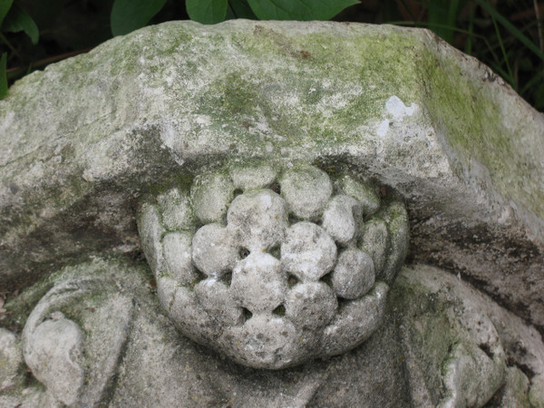 Pair of gothic style stone wall brackets decorated with plants