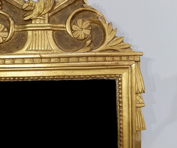 Miroir en bois doré, style louis XVI – Début XXe