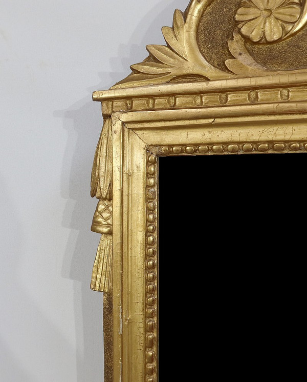 Miroir en bois doré, style louis XVI – Début XXe