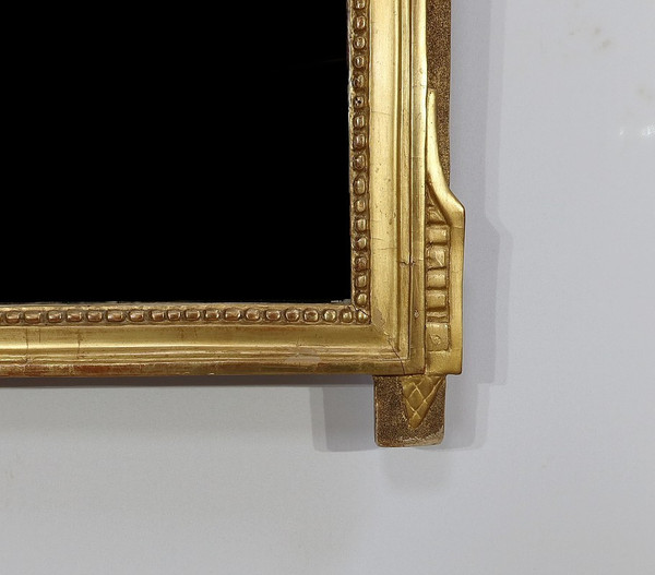 Miroir en bois doré, style louis XVI – Début XXe