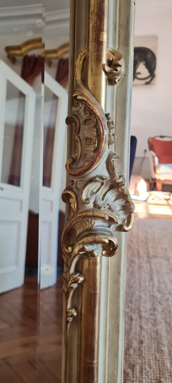 Trumeau mirror in patinated gilded wood