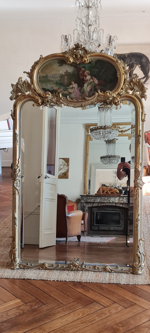 Trumeau mirror in patinated gilded wood