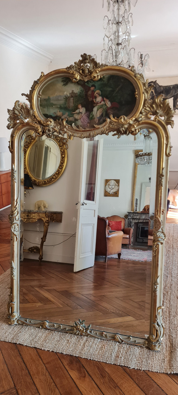 Trumeau mirror in patinated gilded wood