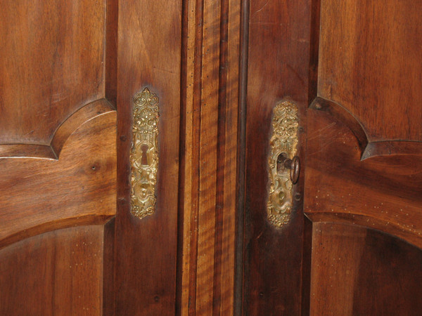 Pair of Louis XV style walnut paneled doors, 19th century