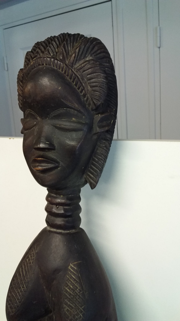 Wakémia ceremonial spoon decorated with a Liberian woman's head