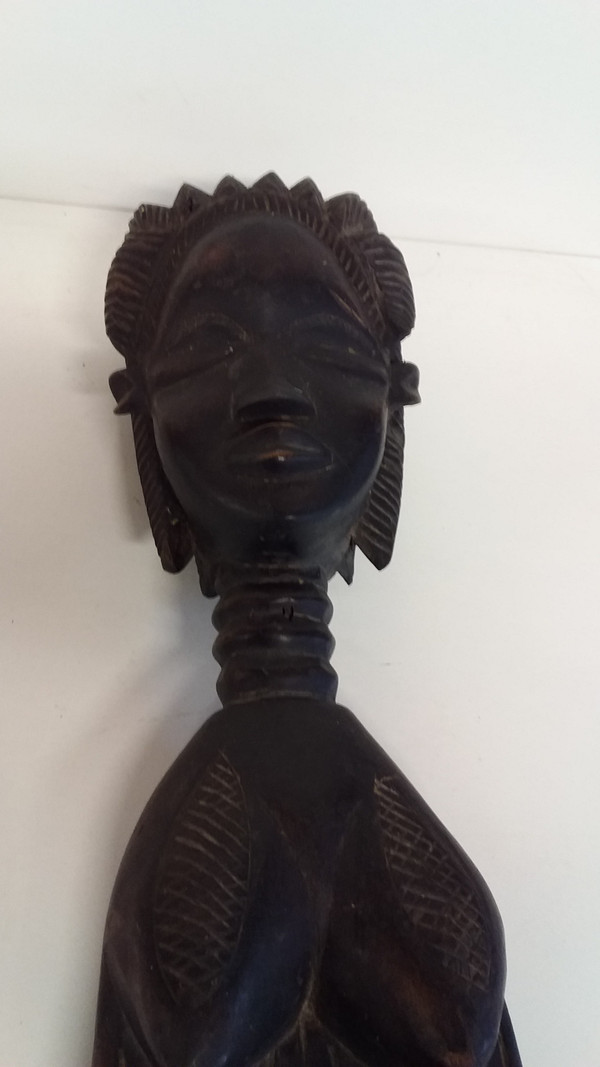 Wakémia ceremonial spoon decorated with a Liberian woman's head