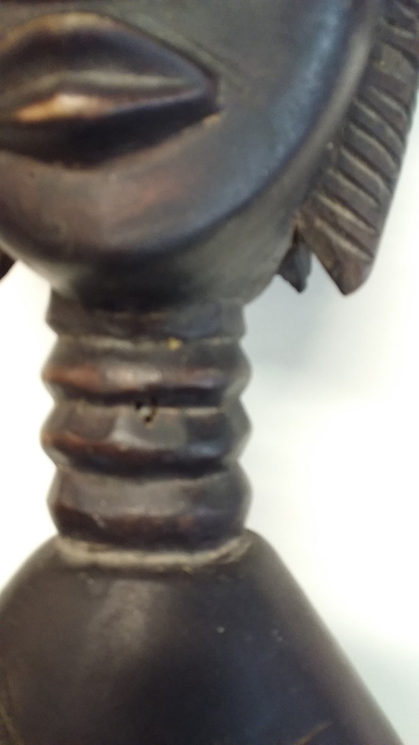 Wakémia ceremonial spoon decorated with a Liberian woman's head