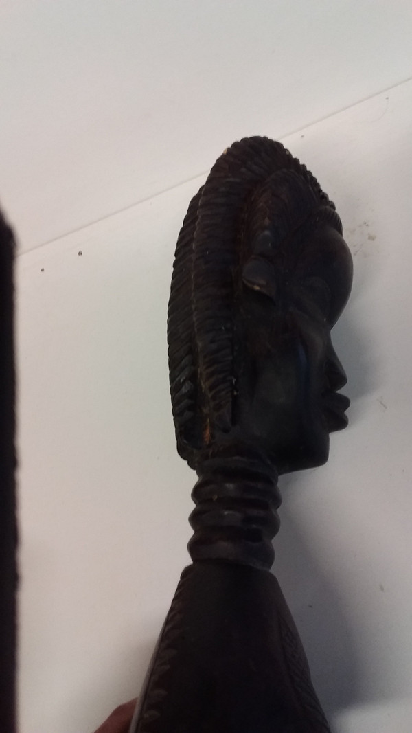 Wakémia ceremonial spoon decorated with a Liberian woman's head