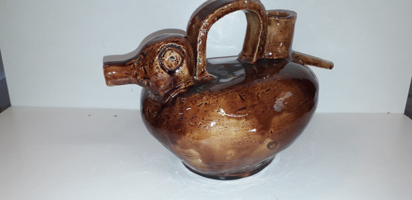 Duck-shaped jug in brown barbotine China, mid-20th century