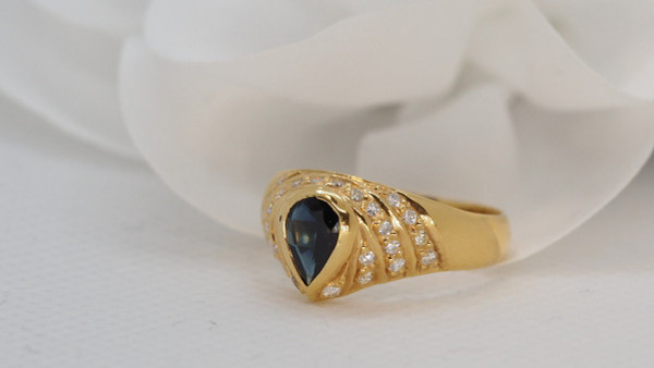 Yellow Gold Ring Set With A Pear Sapphire And Diamonds