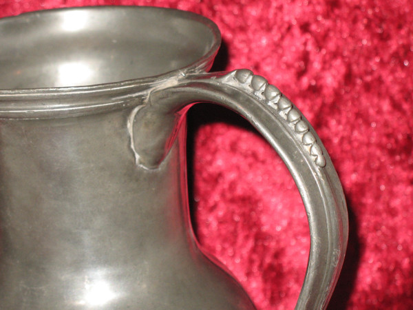 Pewter water jug in the shape of a caterpillar baluster early 18th century