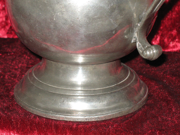 Pewter water jug in the shape of a caterpillar baluster early 18th century