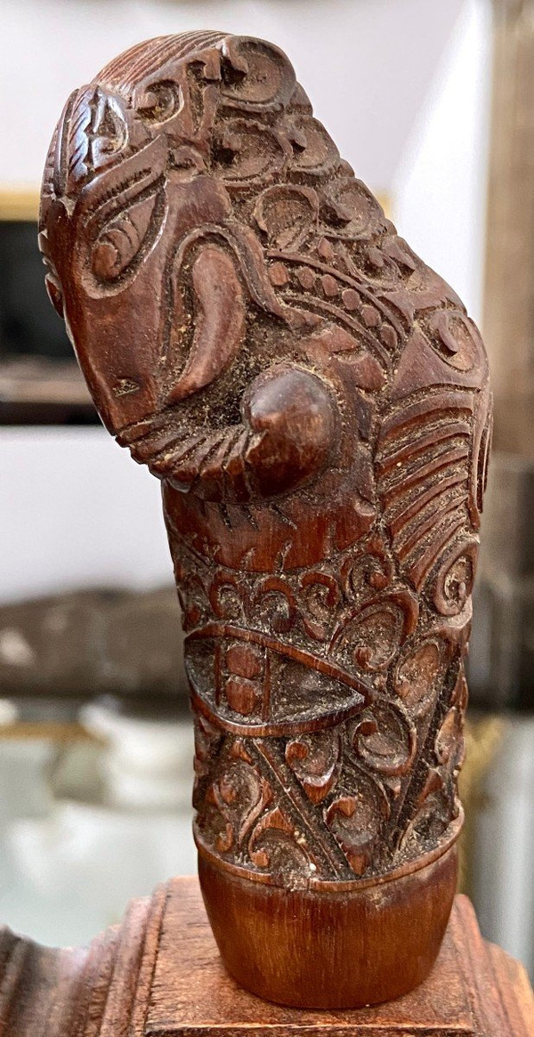 Indonesia, 19th Century, Five Carved Wood Kriss Handles with Anthropo-zoomorph decoration.