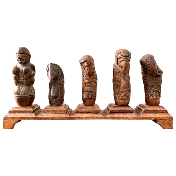 Indonesia, 19th Century, Five Carved Wood Kriss Handles with Anthropo-zoomorph decoration.