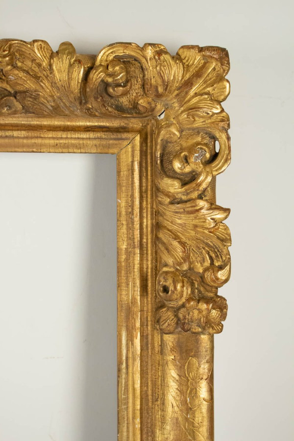 Louis XIV period carved and gilded wood frame with flowered corners, late 17th century