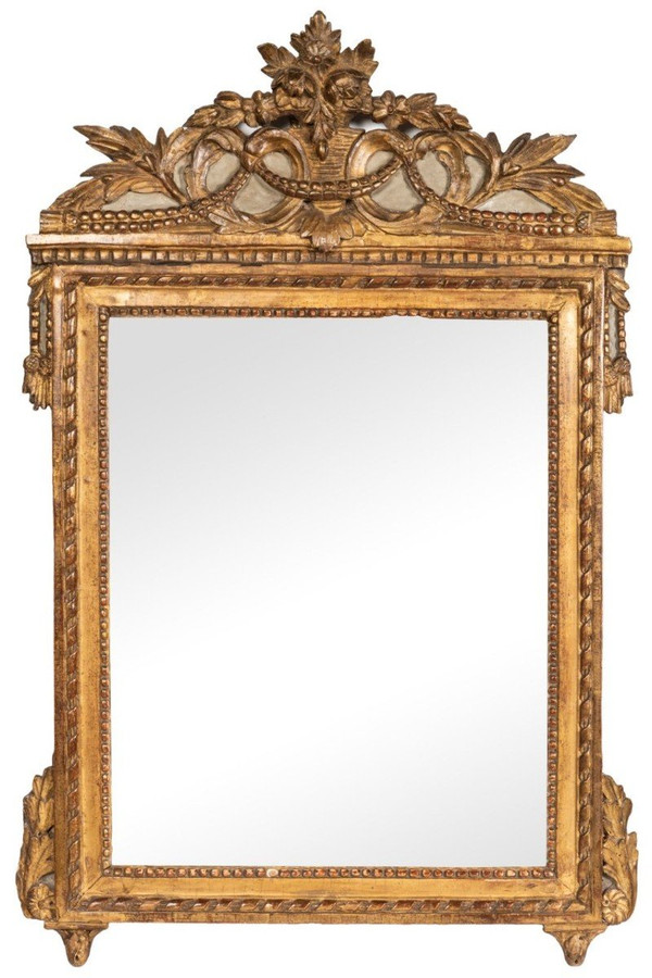 Louis XVI period carved giltwood mirror