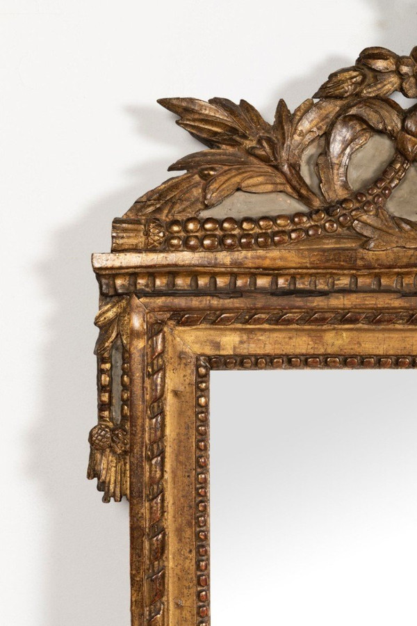 Louis XVI period carved giltwood mirror