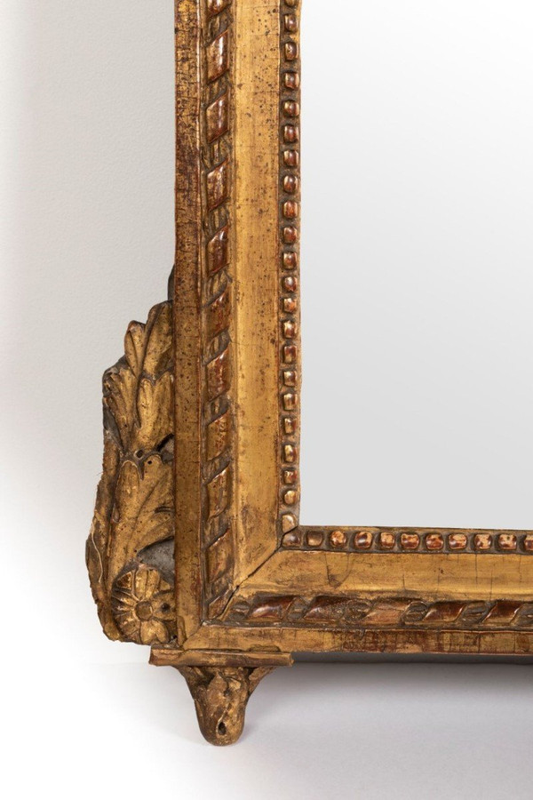 Louis XVI period carved giltwood mirror