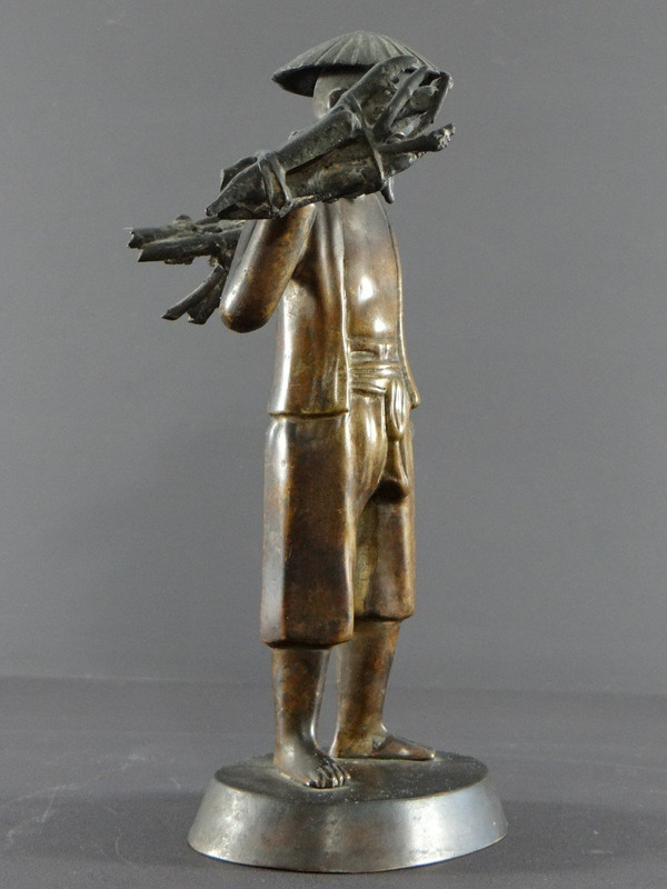 Vietnam, Early 20th Century, Bronze Statuette Peasant Carrying Fagots.