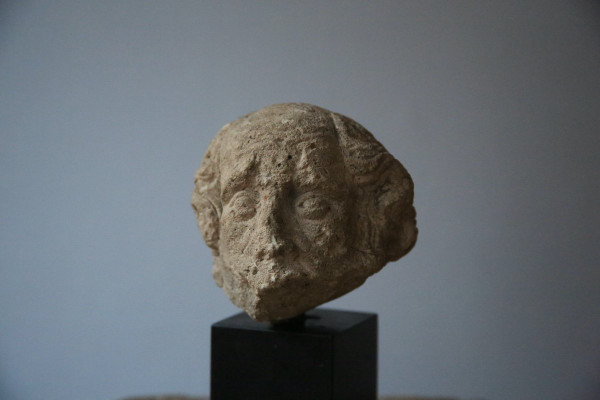 Carved stone head, 15th century.