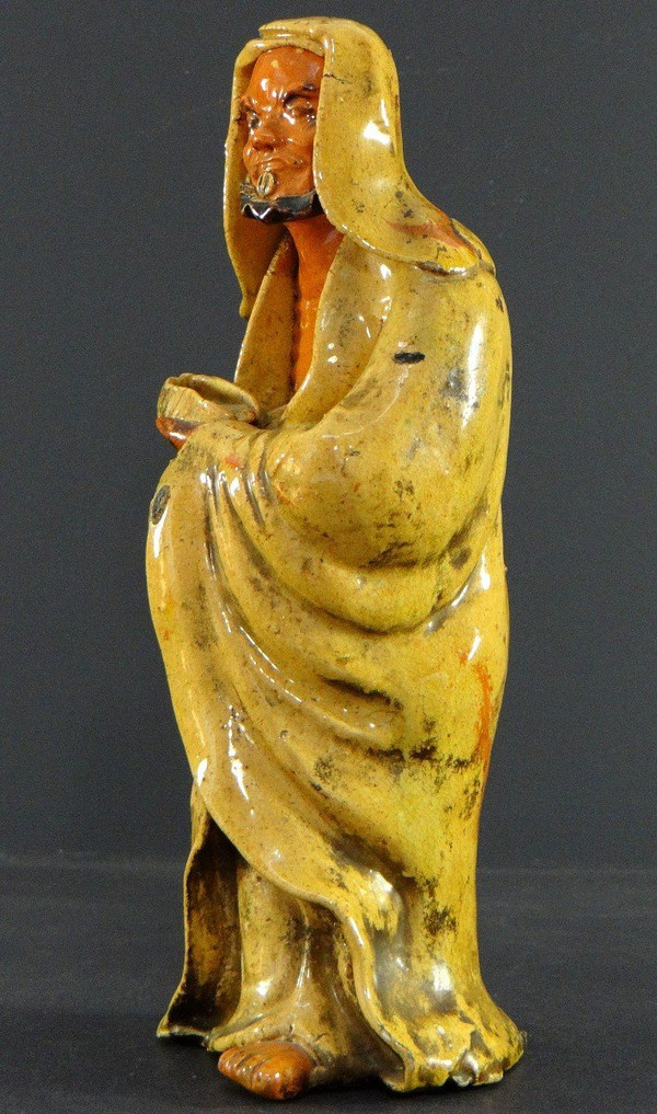 China, Early 20th Century, Glazed Earthenware Arhat Statue.