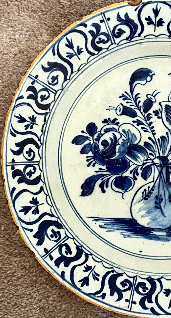 Delft, 18th Century, Earthenware Dish Decorated With Flowered Bottle Vase.