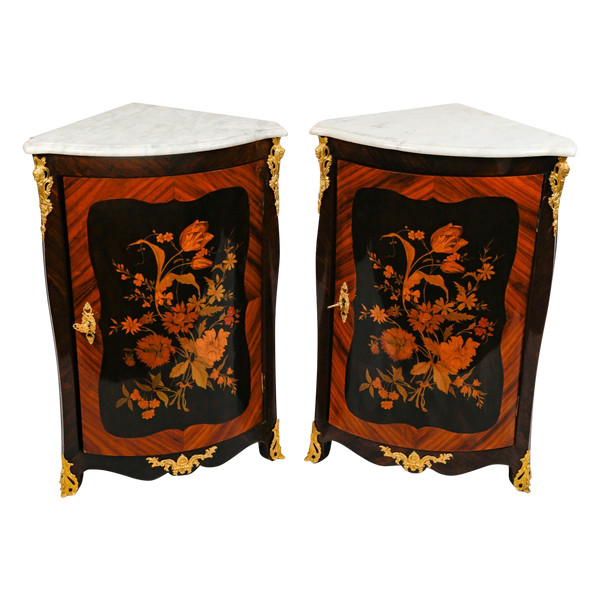 a pair of late 19th century marquetry corner cabinets