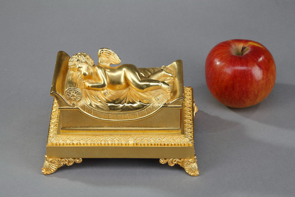 Bronze inkwell of a sleeping putto