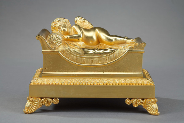 Bronze inkwell of a sleeping putto