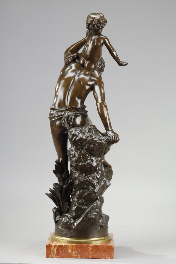 BROWN PATINA BRONZE OF A MAN CARRYING A CHILD ON HIS BACK, BY GASTON LEROUX (1854-1942)