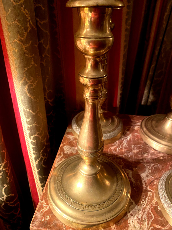 Two pairs of elegant Restoration-period polished bronze guilloche candlesticks