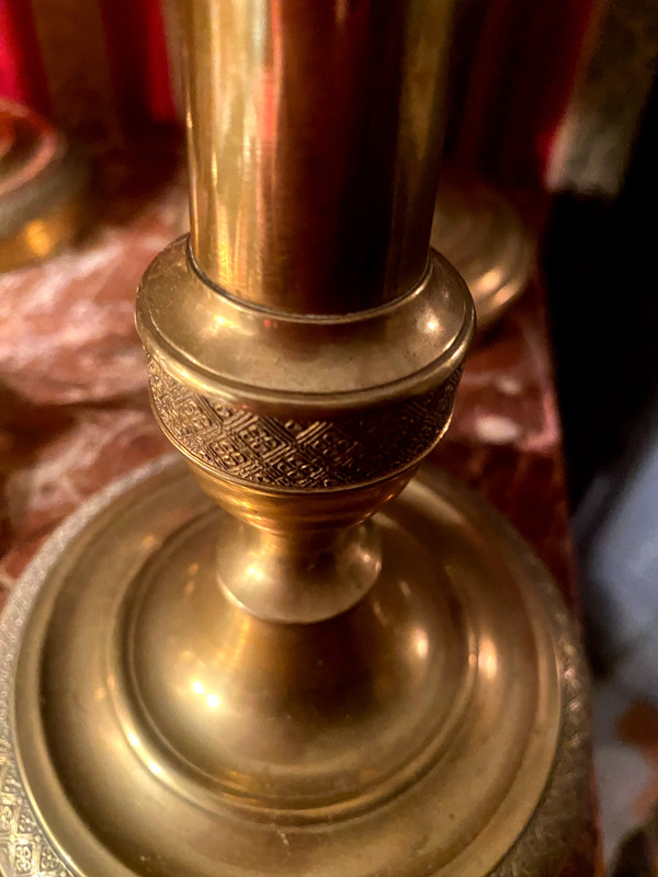 Two pairs of elegant Restoration-period polished bronze guilloche candlesticks