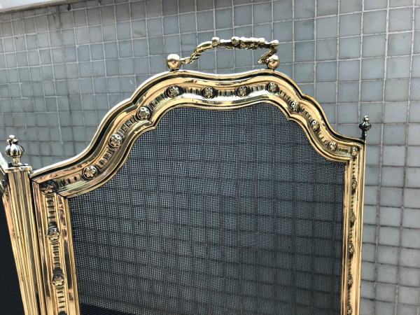 Large old fireplace fire screen in worked brass from the 19th century