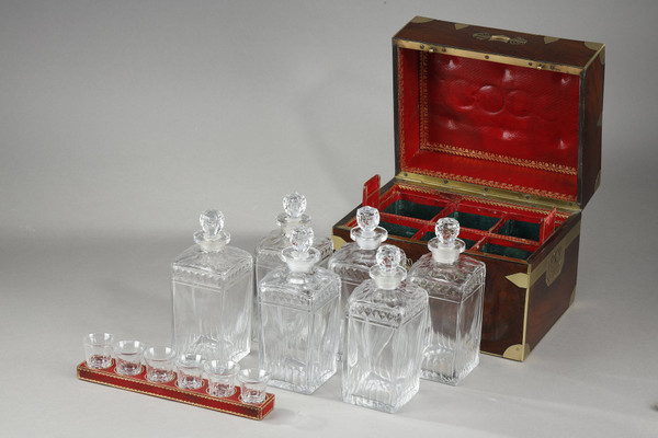 FLAMED MAHOGANY LIQUEUR CELLAR WITH CUT CRYSTAL BOTTLES AND GLASSES