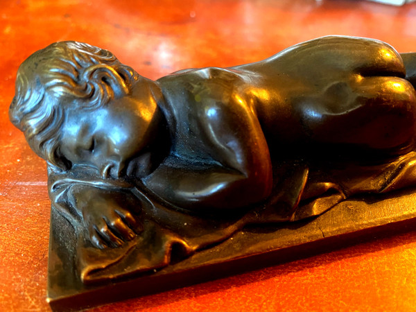 Very fine bronze patina medal of a "Putto", nude sleeping on a sheet from the 19th century