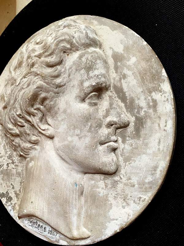 Profile of a man's head in plaster medallion from the Napoleon IIII period signed (Falguière label 1867)